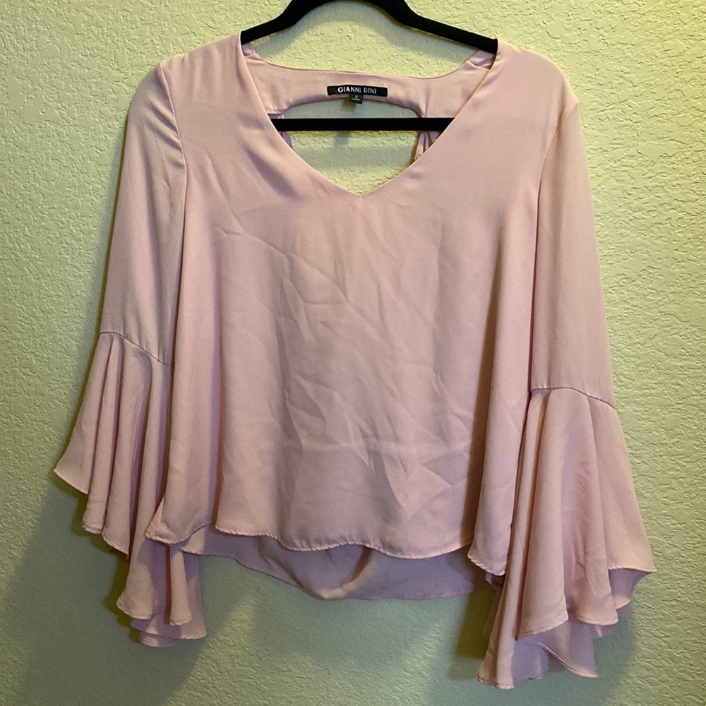 Dillards size small bell sleeve and open back light pink blouse